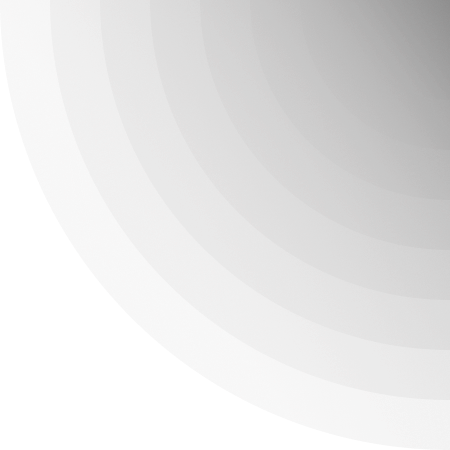 Close-up of a metallic surface with concentric circular patterns and a gradient from light gray to dark gray.